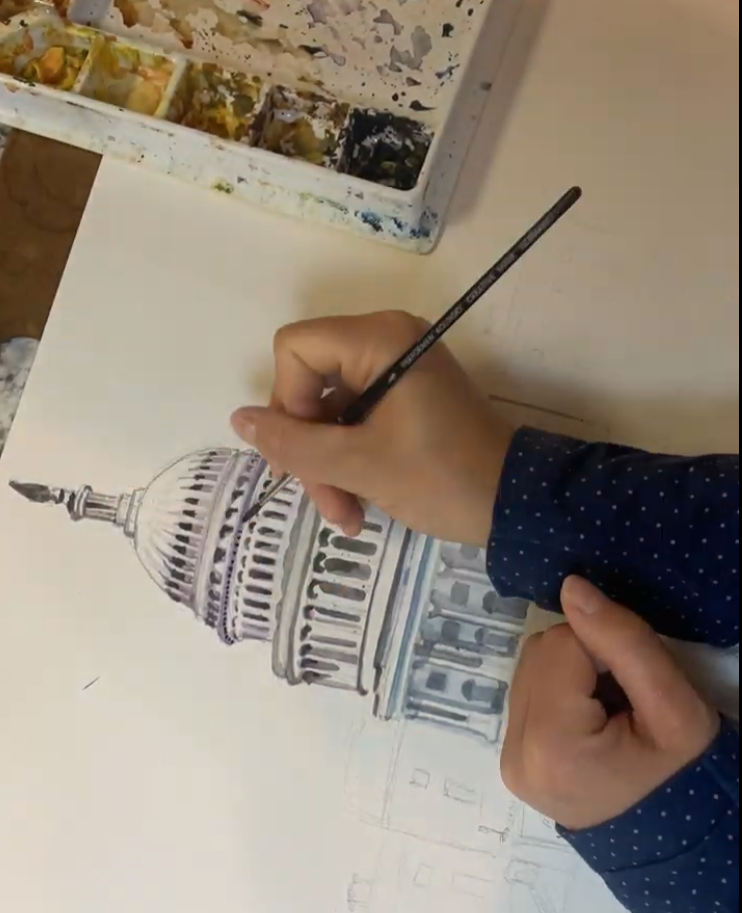 Gretchen painting the U.S. Capitol in watercolor