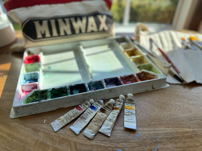 Watercolor paints and supply bag Gretchen received from her first-grade teacher, Mrs. Hughes