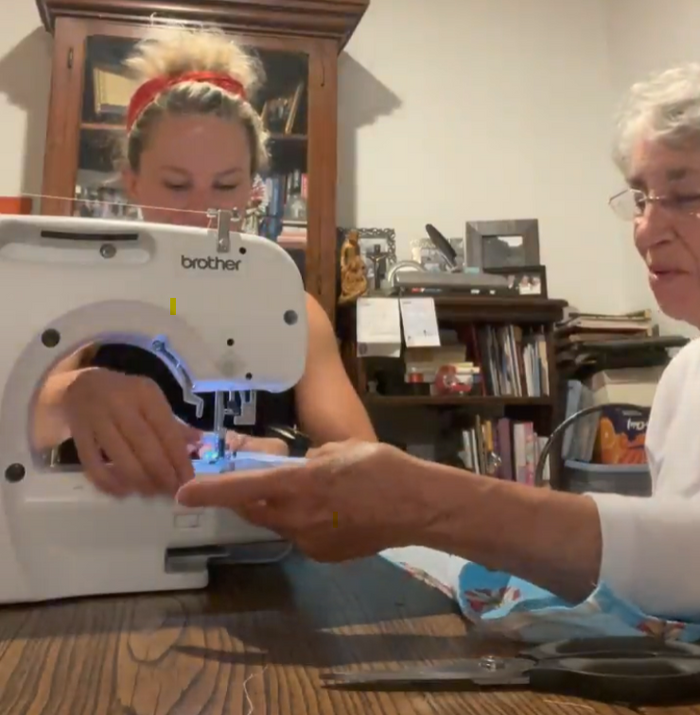 Gretchen's grandmother Mimi giving her a first sewing lesson