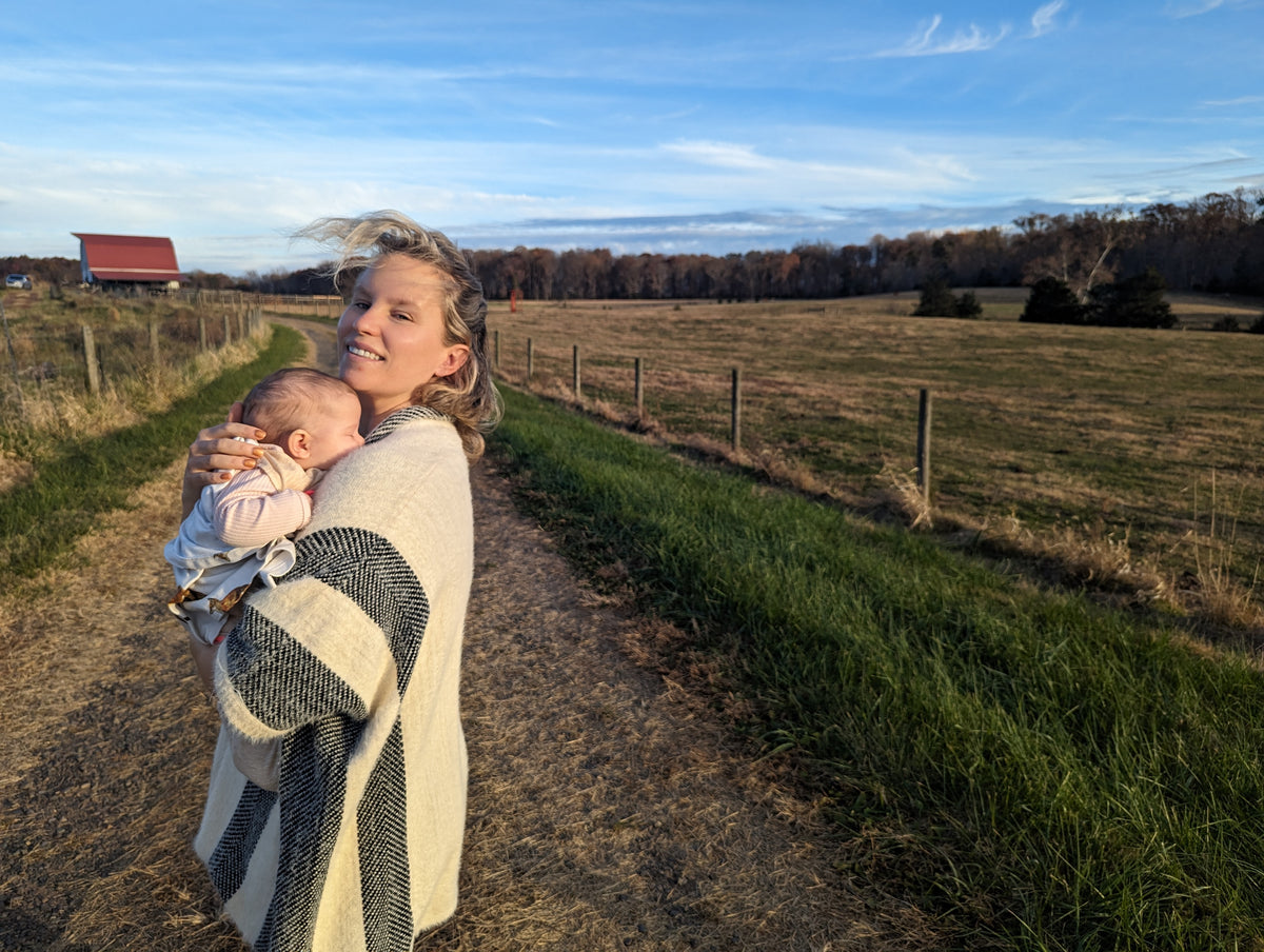 Gretchen Pace holding her baby on the family farm in Orange, Virginia